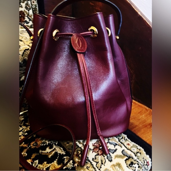 Cartier Handbags - CARTIER Ox Blood Burgundy Rouge Leather Drawstring Bucket Bag -VINTAGE OLD MONEY